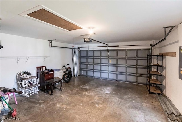 garage featuring a garage door opener