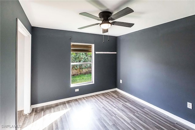 spare room with ceiling fan and light hardwood / wood-style flooring