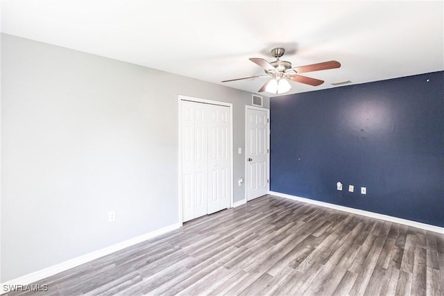 unfurnished bedroom with ceiling fan, light hardwood / wood-style floors, and a closet