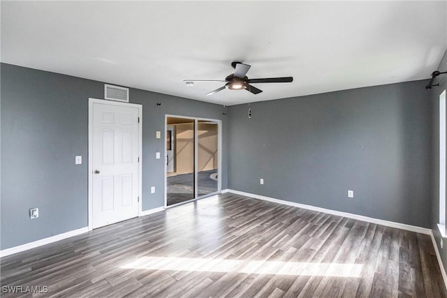 spare room with hardwood / wood-style flooring and ceiling fan