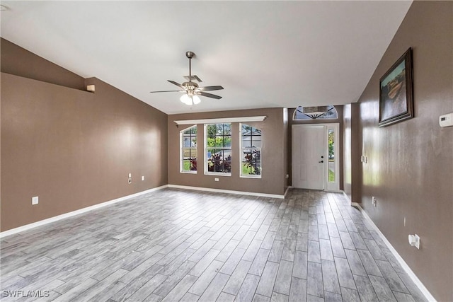 interior space with lofted ceiling, light hardwood / wood-style flooring, and ceiling fan