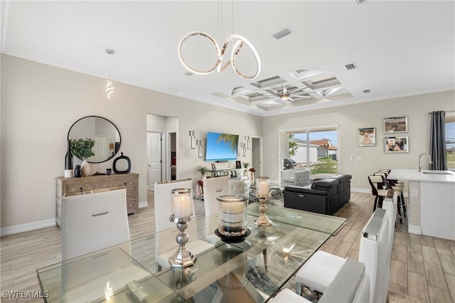 dining area with coffered ceiling, sink, crown molding, ceiling fan, and beam ceiling