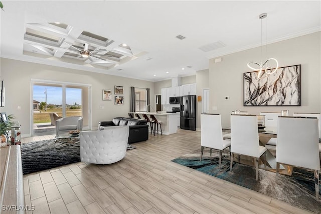 interior space with coffered ceiling, crown molding, and light hardwood / wood-style flooring