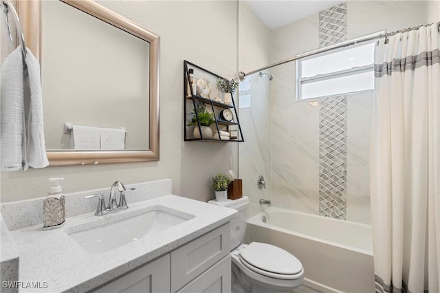 full bathroom featuring shower / bathtub combination with curtain, vanity, and toilet