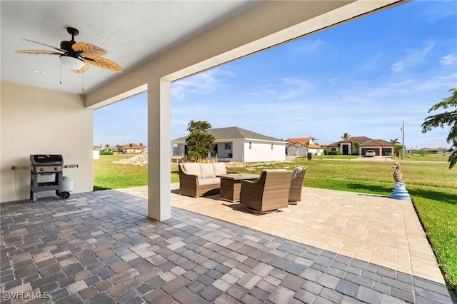 view of patio with grilling area, an outdoor hangout area, and ceiling fan