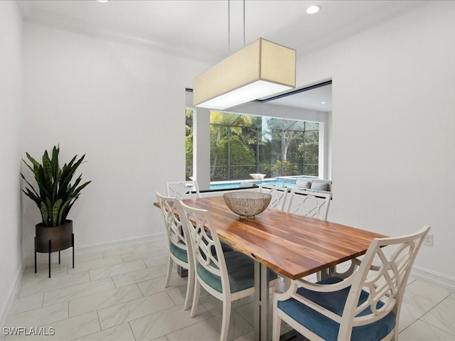 dining area featuring ornamental molding