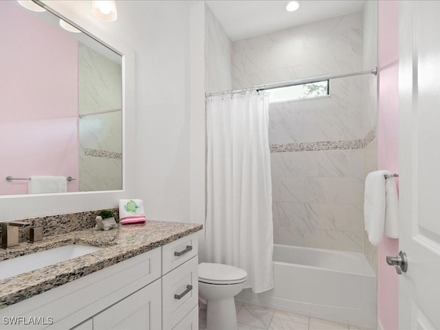 full bathroom with vanity, toilet, and shower / tub combo