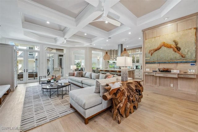 living room with french doors, coffered ceiling, light hardwood / wood-style flooring, and beamed ceiling