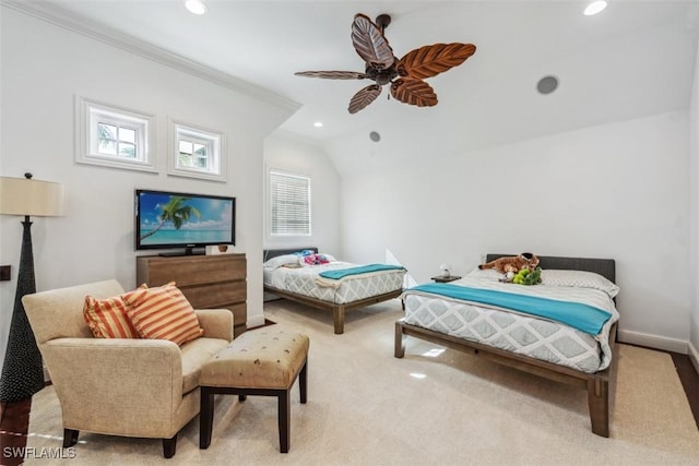 bedroom featuring crown molding, vaulted ceiling, light carpet, and ceiling fan