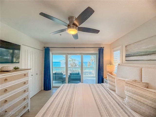 4611 Seair Ln, Upper Captiva, FL 33924 - bedroom with ceiling fan, light wood-type flooring, multiple windows, and access to outside