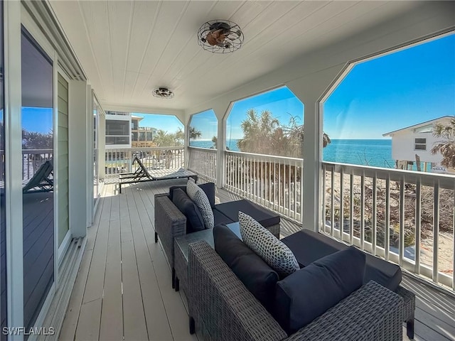 4611 Seair Ln, Upper Captiva, FL 33924 - wooden terrace with a water view and outdoor lounge area