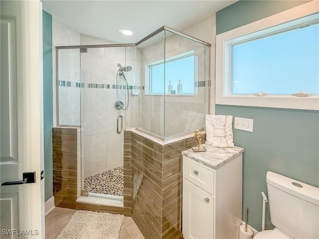 4611 Seair Ln, Upper Captiva, FL 33924 - bathroom with a shower with shower door and toilet