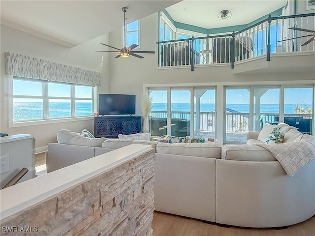 4611 Seair Ln, Upper Captiva, FL 33924 - living room featuring a towering ceiling, ceiling fan, and light hardwood / wood-style flooring