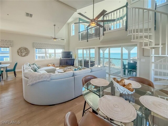 4611 Seair Ln, Upper Captiva, FL 33924 - living room with a high ceiling, ceiling fan, and light wood-type flooring