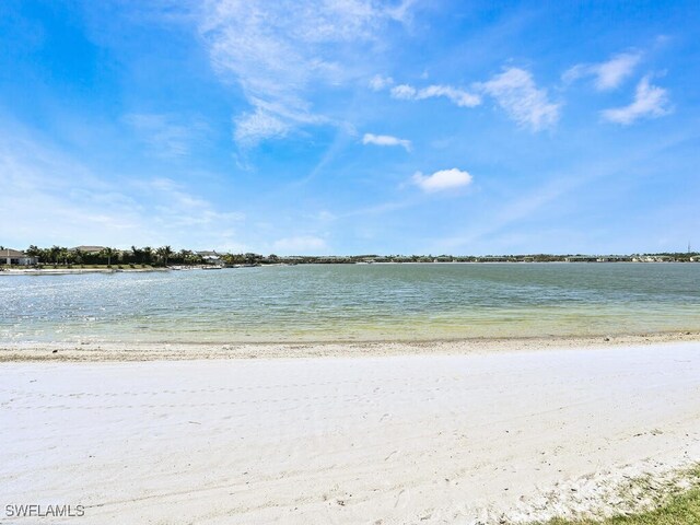 property view of water featuring a beach view