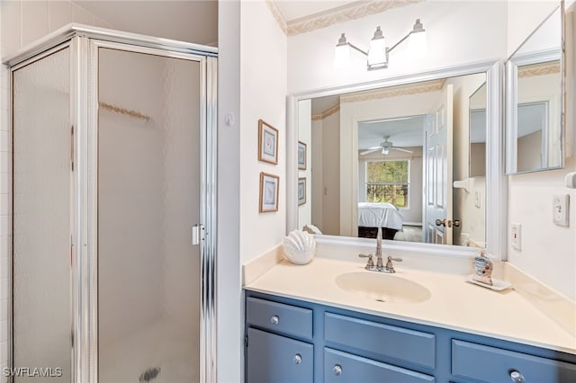 bathroom featuring a shower stall, vanity, and ensuite bathroom