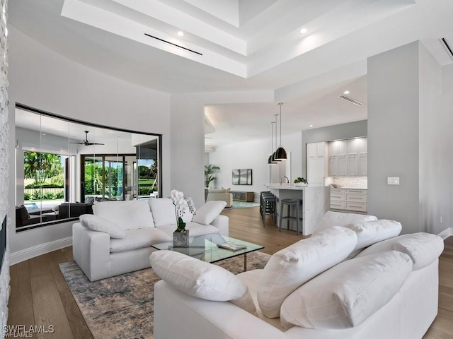 living room with dark hardwood / wood-style flooring