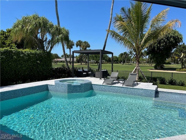 view of swimming pool featuring an in ground hot tub and a patio area