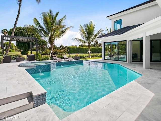 view of pool with an in ground hot tub, pool water feature, a patio, and a pergola