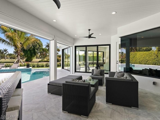 view of patio / terrace featuring a fenced in pool, an outdoor hangout area, and ceiling fan