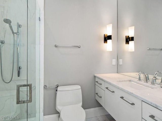 bathroom with vanity, toilet, and walk in shower