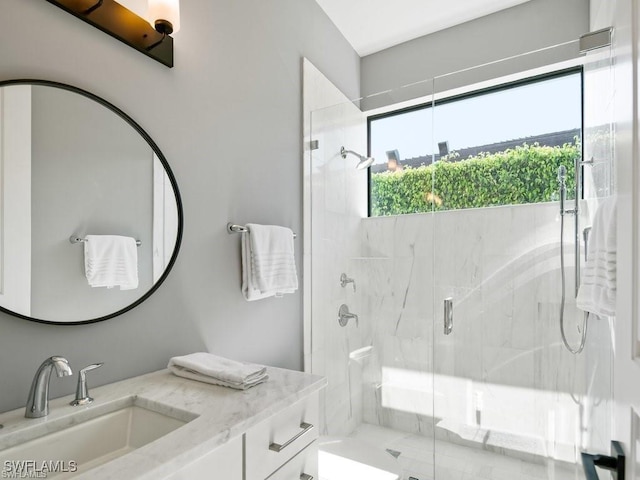 bathroom with vanity and an enclosed shower