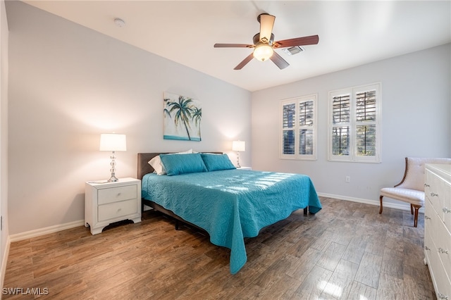 bedroom with ceiling fan and wood-type flooring