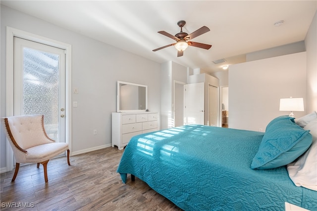 bedroom with access to exterior, hardwood / wood-style flooring, and ceiling fan