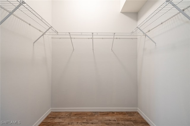 walk in closet featuring hardwood / wood-style floors