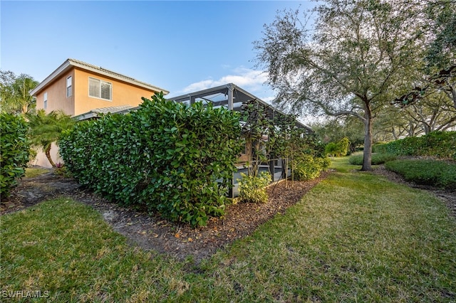 view of yard with a lanai