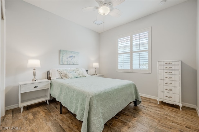 bedroom with hardwood / wood-style flooring and ceiling fan