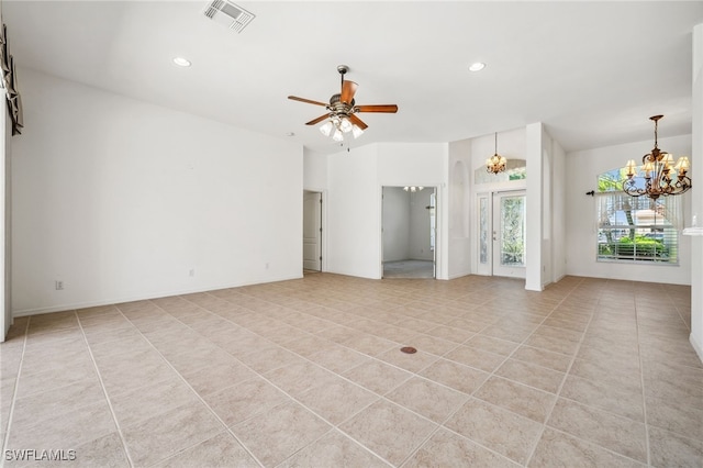 empty room featuring light tile patterned floors, recessed lighting, visible vents, and ceiling fan with notable chandelier