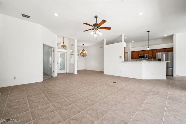 unfurnished living room with light tile patterned flooring, recessed lighting, visible vents, and ceiling fan with notable chandelier