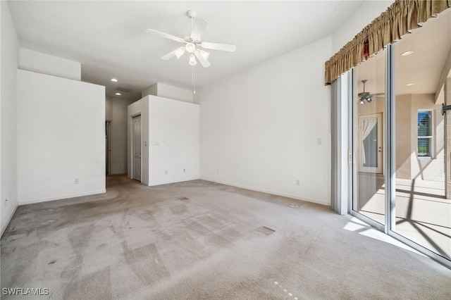 unfurnished room with recessed lighting, light carpet, ceiling fan, and baseboards