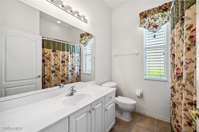 full bath featuring tile patterned flooring, baseboards, vanity, and toilet