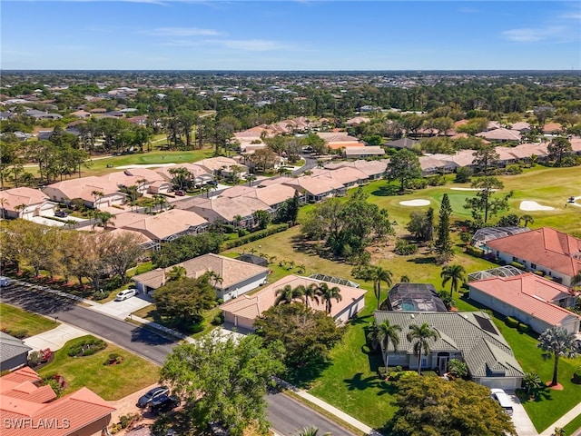 aerial view featuring view of golf course and a residential view