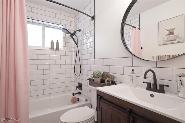 full bathroom with shower / bath combo, tile walls, backsplash, vanity, and toilet