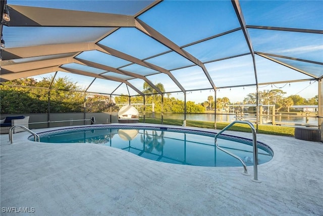 view of swimming pool featuring a water view, a lanai, and a patio