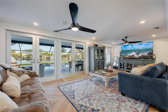 living room featuring french doors, a water view, light parquet flooring, and crown molding