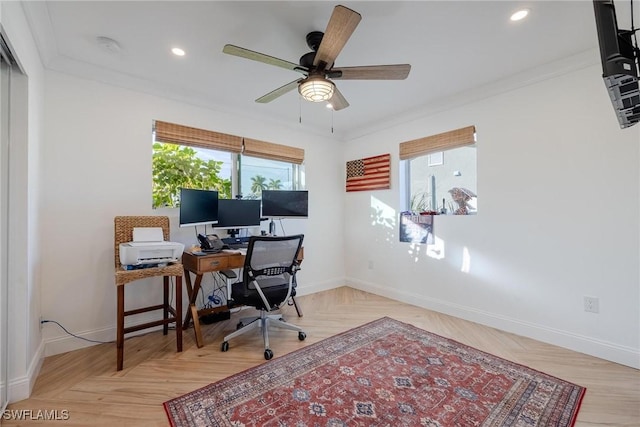 office featuring crown molding, ceiling fan, and light parquet flooring