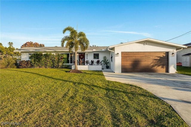 single story home featuring a garage and a front lawn