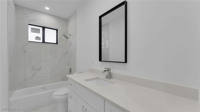 full bathroom featuring vanity, tiled shower / bath, and toilet