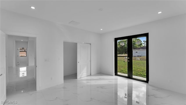 spare room featuring french doors