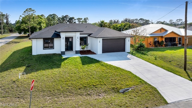 view of front facade with a garage and a front yard