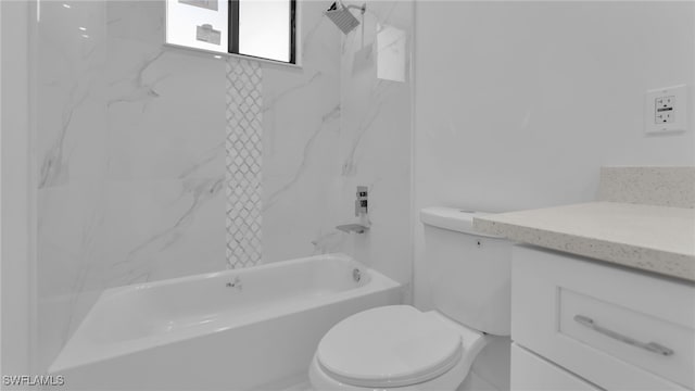 full bathroom with tiled shower / bath, vanity, and toilet