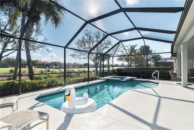 view of pool featuring an in ground hot tub, a lanai, and a patio