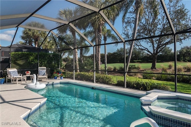 view of pool with a lanai, a patio area, and an in ground hot tub