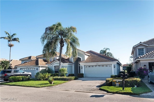 mediterranean / spanish home featuring a garage