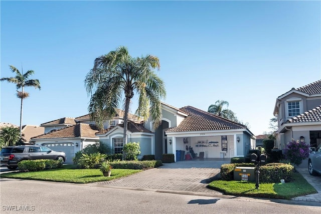 mediterranean / spanish house with a garage