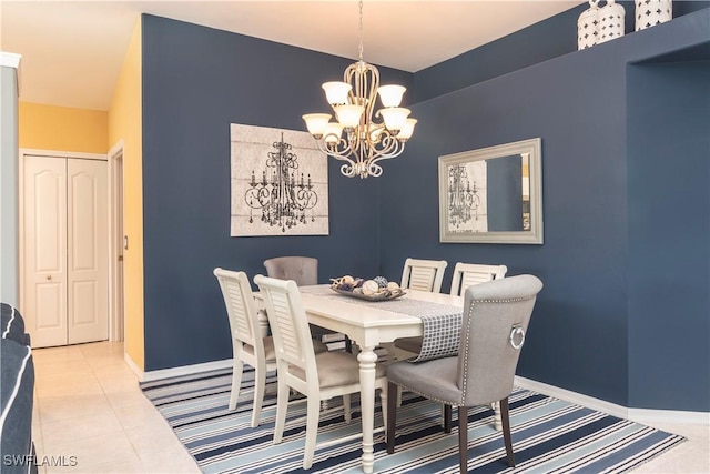 tiled dining area with an inviting chandelier